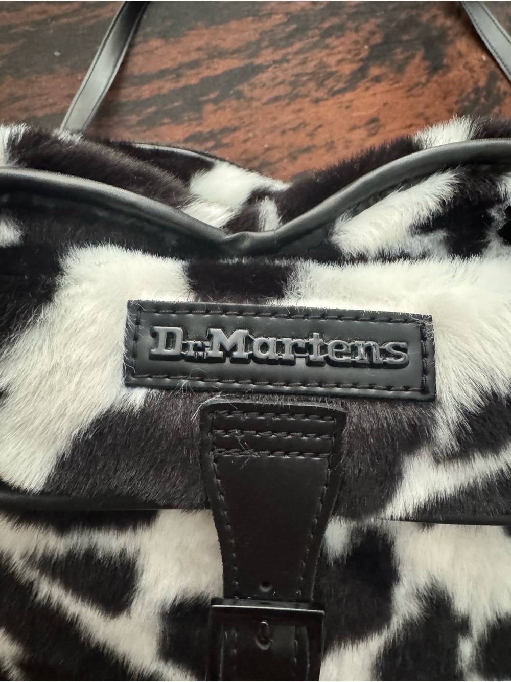 Dr. Martens Black and White Cow-Print Heart Crossbody - Picture 4 of 6